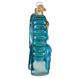 Blue glass ornament shaped like a shoe on a white background