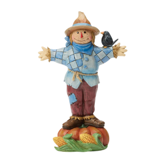 Scarecrow Standing on Pumpkin