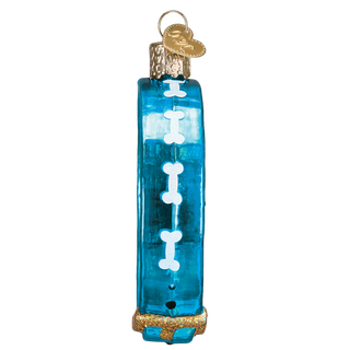 Blue glass ornament with white details on a white background