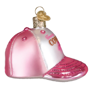 Pink and white glass ornament shaped like a cowboy hat with 'Sweet Cowgirl' text on a white background