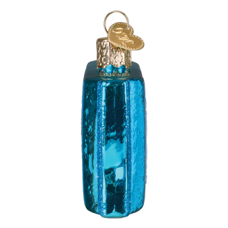 Blue glass ornament with gold top on a white background