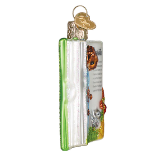 Decorative glass ornament shaped like a book with butterfly illustrations on a white background