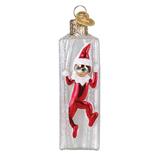 Christmas ornament of an elf in a bottle on a white background